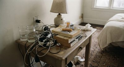 Your Nightstand Is Cluttered. Here's the Three-Thing Rule.
